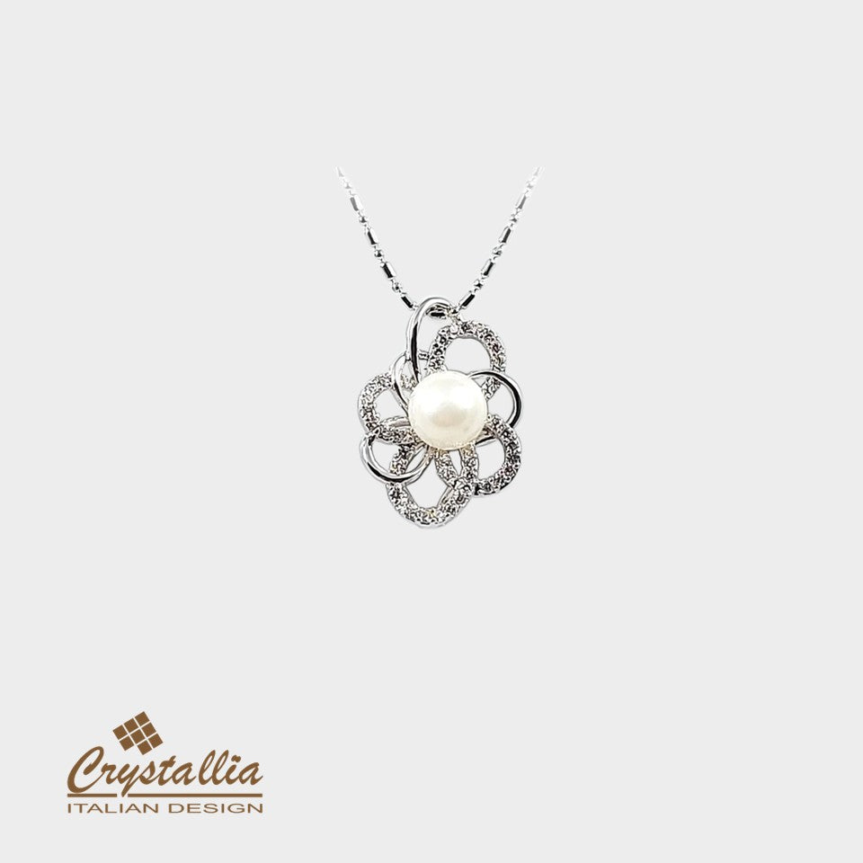 Pearl necklace with floral design on a white background, featuring the Crystallia brand.