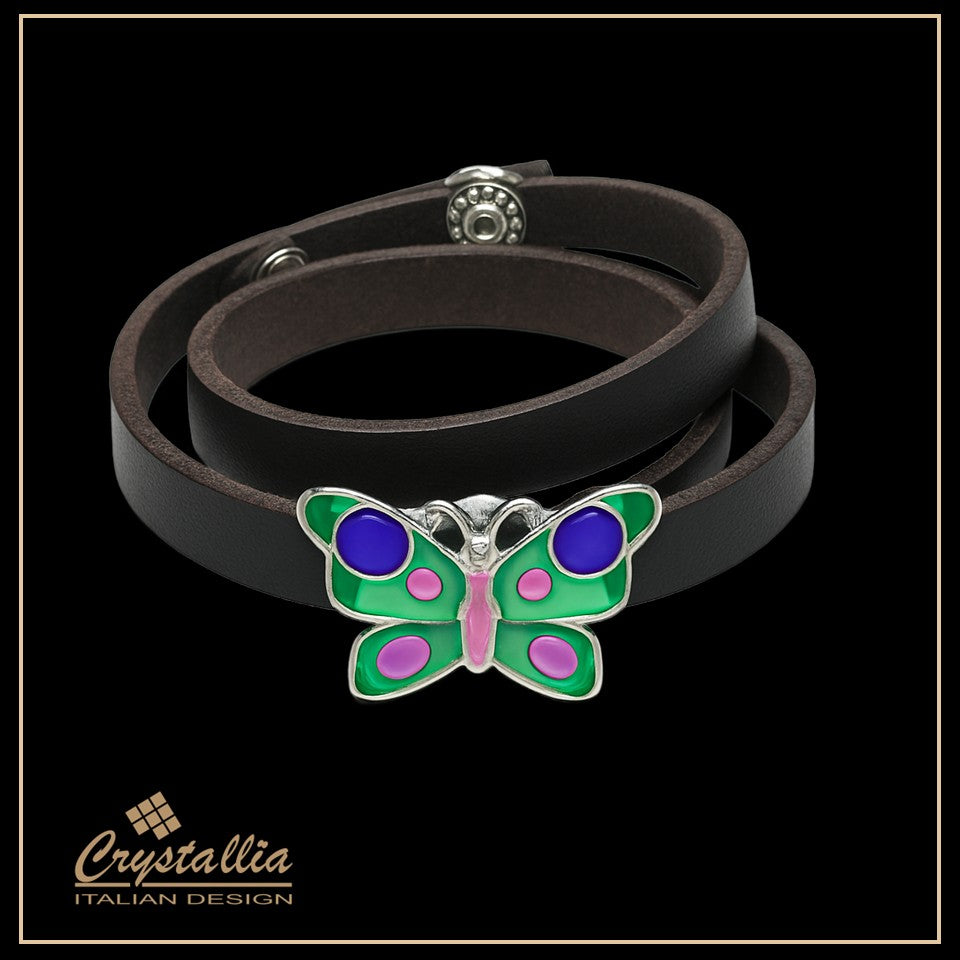 Black leather bracelet with a colorful butterfly charm on a black background, featuring the Crystallia brand.