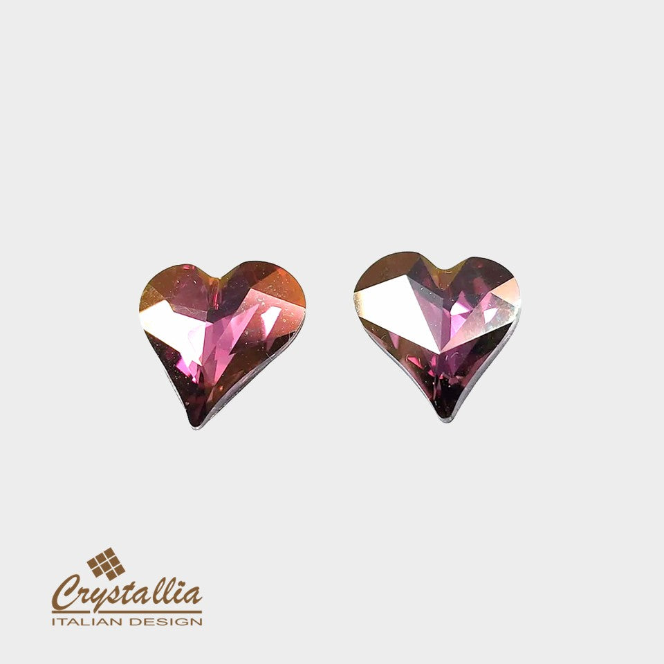 Heart-shaped gemstones with Crystallia logo on a light gray background