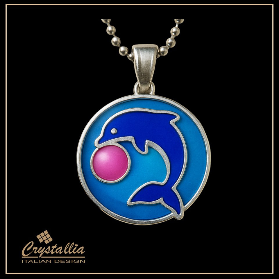 Dolphin pendant with pink ball on blue background, Crystallia brand visible