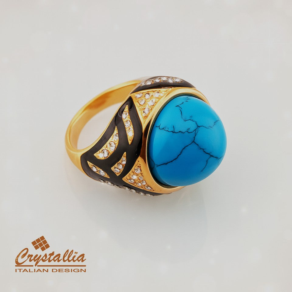 Gold ring with turquoise stone and Crystallia branding on a light background