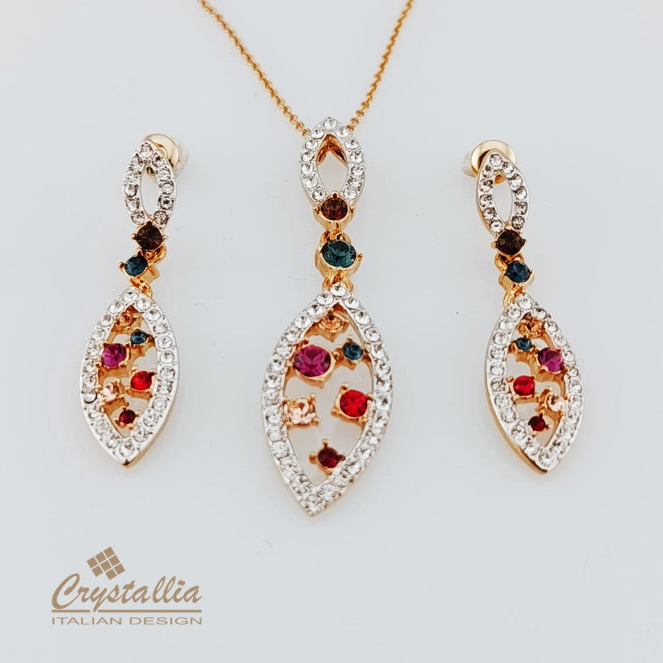 Jewelry set with earrings and a necklace featuring multicolored gemstones on a light gray background.