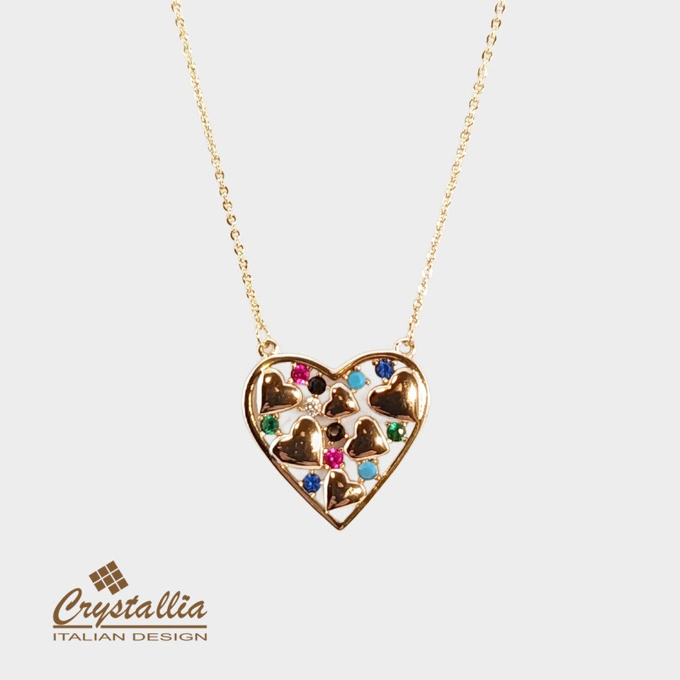 Heart-shaped necklace with colorful stones on a light gray background, featuring the Crystallia brand.
