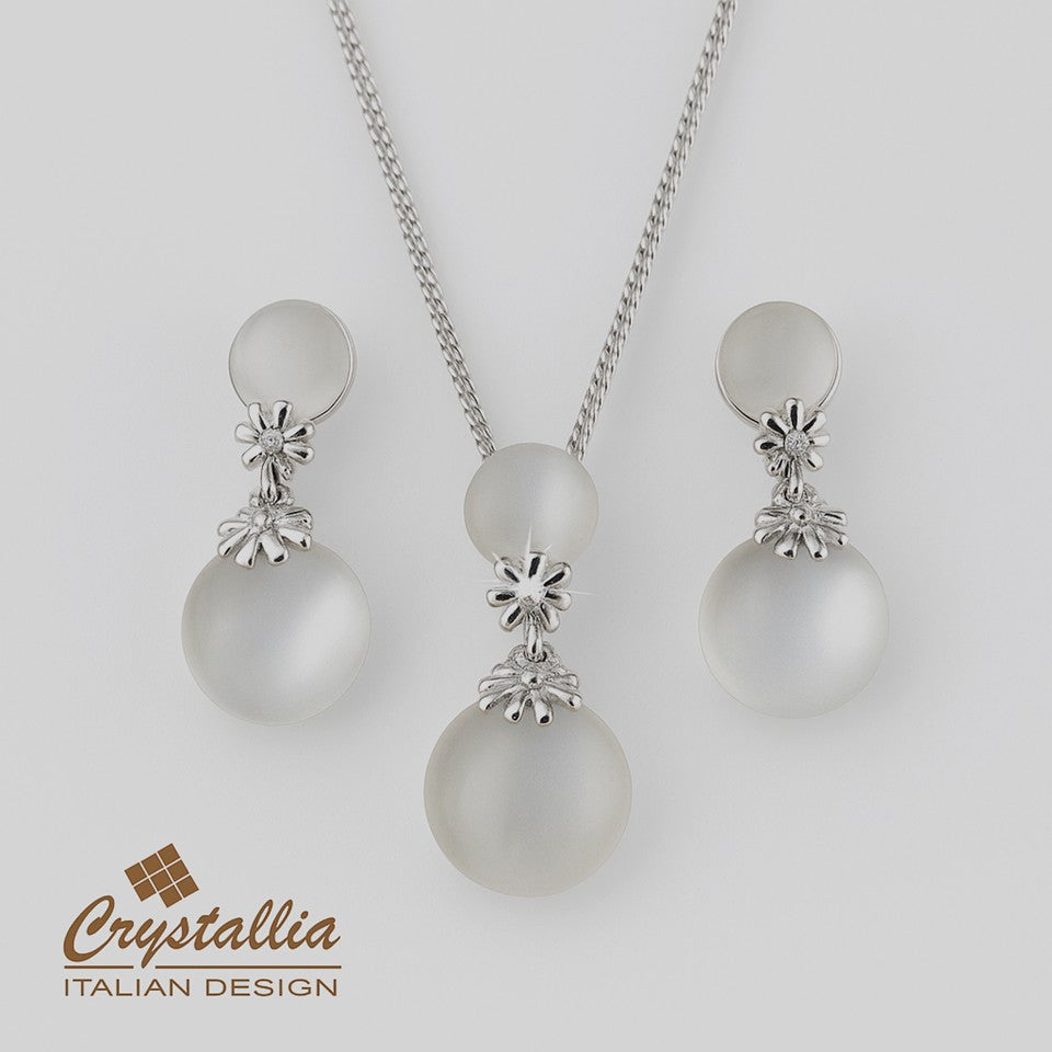 Pearl necklace and earrings set with Crystallia branding on a light gray background