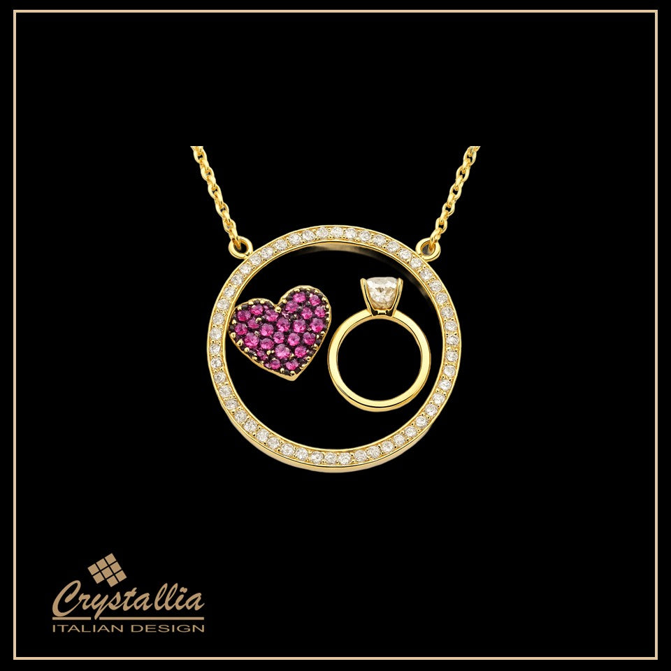 Gold necklace with heart-shaped pendant and ring design on a black background, featuring the Crystallia brand.