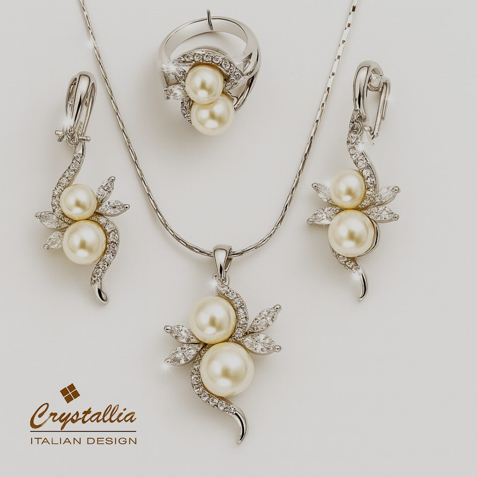 Pearl jewelry set with necklace, earrings, and ring on a white background, featuring the Crystallia brand.