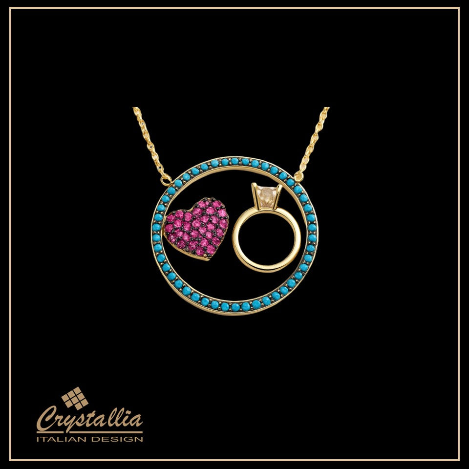 Jewelry set with heart and ring design on a black background, featuring the Crystallia brand.