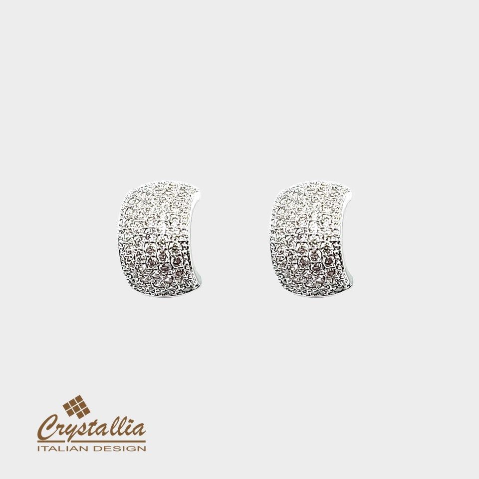 Pair of silver earrings with Crystallia logo on a white background