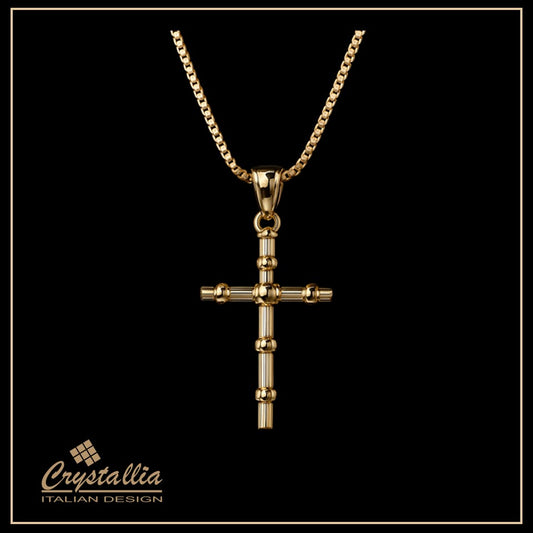 Gold cross necklace on a black background with Crystallia branding.