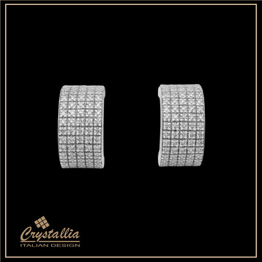 Pair of silver hoop earrings on a black background with Crystallia logo.