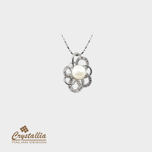Pearl necklace with floral design on a white background, featuring the Crystallia brand.