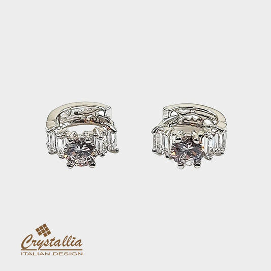 Pair of diamond earrings with 'Crystallia' branding on a white background