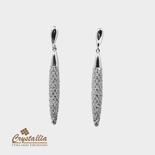 Pair of silver earrings with Crystallia logo on a light gray background