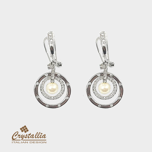 Pair of silver earrings with pearls on a white background, featuring the Crystallia brand.