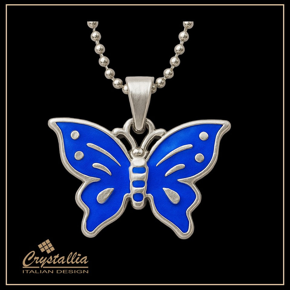 Blue butterfly pendant with silver chain on a black background, featuring the Crystallia brand.