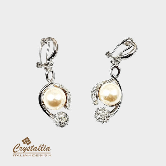 Pair of pearl earrings with Crystallia logo on a light background