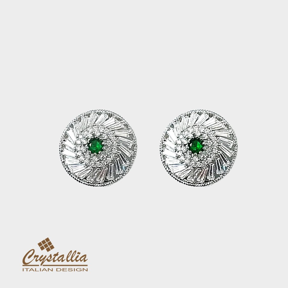 Pair of silver earrings with green gemstones on a white background, featuring the Crystallia brand.