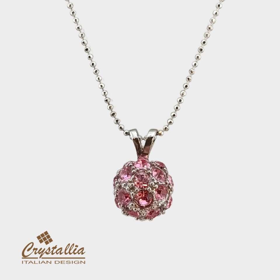 Pink crystal pendant necklace on a white background with Crystallia brand logo.