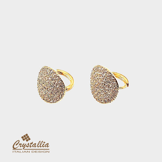 Gold rings with textured design on a light gray background, featuring the Crystallia brand.