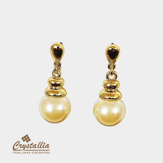 Gold earrings with pearls on a white background, featuring the Crystallia brand.