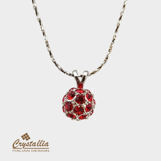Red gemstone pendant on a chain with Crystallia logo