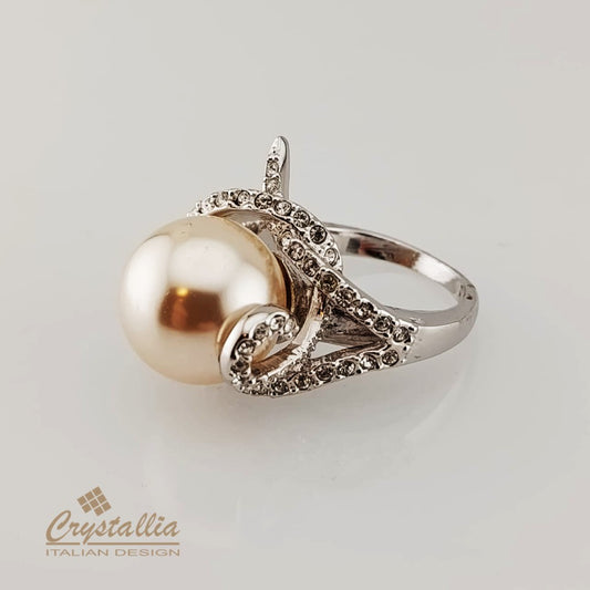 Silver ring with a large pearl and smaller stones on a light gray background, featuring the Crystallia brand.