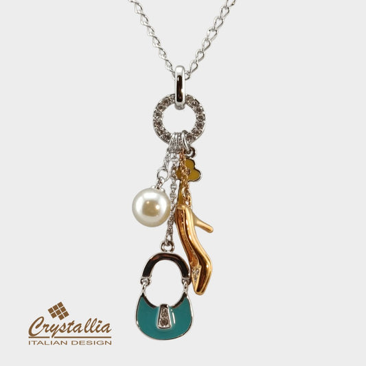 Necklace with charms on a white background, featuring the Crystallia brand.