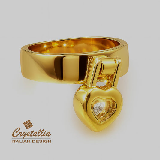 Gold ring with heart-shaped design and diamond on a white background, featuring Crystallia branding.