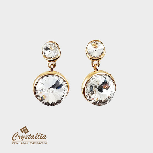 Gold earrings with clear gemstones on a white background, featuring the Crystallia brand.