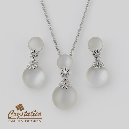 Pearl necklace and earrings set with Crystallia branding on a light gray background