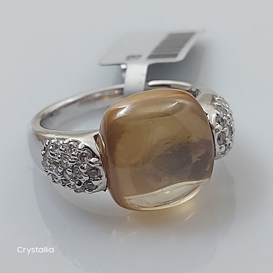 An 18 K gold plated bracelet with a large brown crystal surrounded by smaller clear crystals, with a silver clasp.