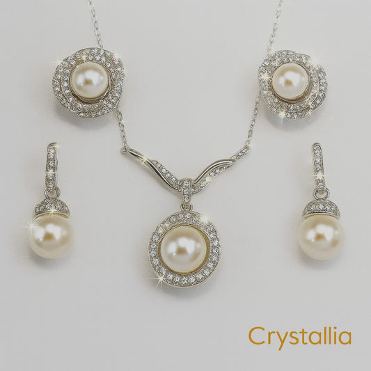 Pearl jewelry set with necklace and earrings on a light gray background, featuring the brand 'Crystallia'.